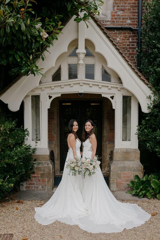 Two Brides at the original front door of alexander House