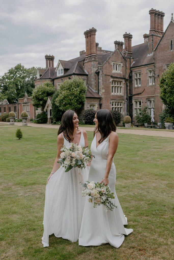 Two brides on the lawn at alexander House, West Sussex Dog friendly wedding venue